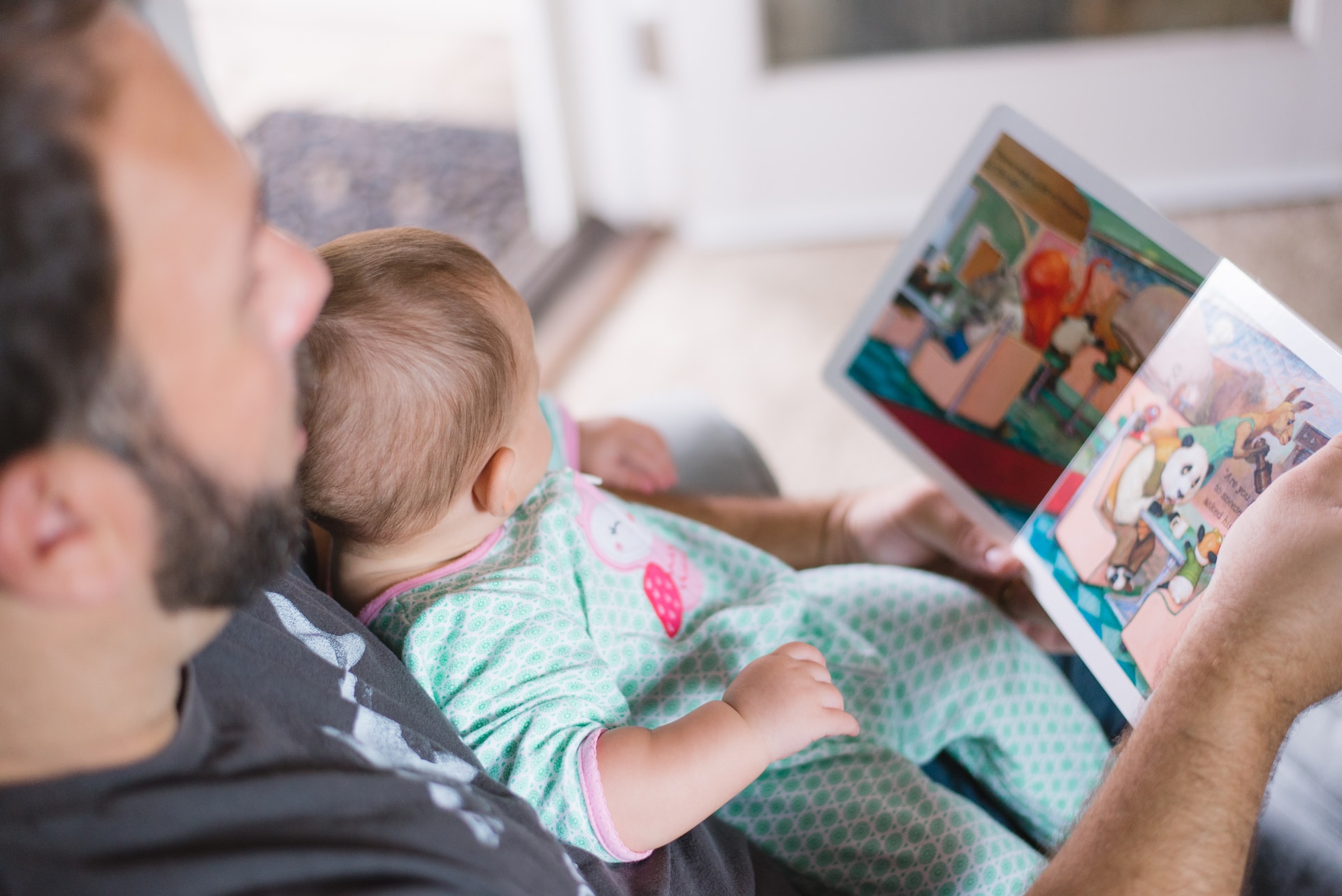 A father reading to his toddler